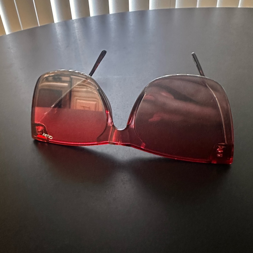 Pink “Quay Australia “ sunglasses.